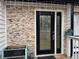 House exterior with new stone and black front door at 702 Talemwood Ct, Lawrenceville, GA 30044