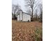 House with white siding, black accents, and a deck at 702 Talemwood Ct, Lawrenceville, GA 30044