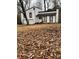 House with white siding, black accents, and a large yard at 702 Talemwood Ct, Lawrenceville, GA 30044