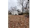 House with white siding, black accents, and a deck at 702 Talemwood Ct, Lawrenceville, GA 30044