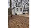 Two-car garage and deck on a white house with black trim at 702 Talemwood Ct, Lawrenceville, GA 30044