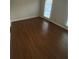 Spacious living room with wood-look flooring at 894 Glynn Oaks Dr, Clarkston, GA 30021