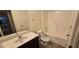 Clean bathroom with tub, toilet and vanity with dark wood cabinets at 3551 Brycewood Dr, Decatur, GA 30034