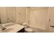 Clean bathroom with tub, toilet and vanity with dark wood cabinets at 3551 Brycewood Dr, Decatur, GA 30034