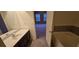Bathroom with tub, shower, and double vanity at 3551 Brycewood Dr, Decatur, GA 30034