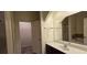 Primary bathroom with double vanity and walk-in closet at 3551 Brycewood Dr, Decatur, GA 30034