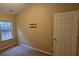 Simple bedroom with neutral walls, carpet, and a window at 3551 Brycewood Dr, Decatur, GA 30034