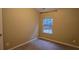 Simple bedroom with carpeted floor and a window at 3551 Brycewood Dr, Decatur, GA 30034