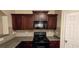 Close-up of kitchen stove and microwave at 3551 Brycewood Dr, Decatur, GA 30034