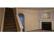 Living room with fireplace, stairs, and neutral color scheme at 3551 Brycewood Dr, Decatur, GA 30034