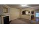 Open living room with a view of the kitchen and fireplace at 3551 Brycewood Dr, Decatur, GA 30034