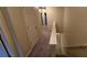 Upstairs hallway with carpet, doors to bedrooms, and staircase at 3551 Brycewood Dr, Decatur, GA 30034