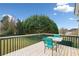 Lovely back deck with green stained rails and table with four chairs at 1379 Paddocks Way, Powder Springs, GA 30127