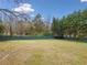 Great view of the oversized level backyard and mature trees at 1379 Paddocks Way, Powder Springs, GA 30127