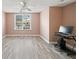 Bedroom with neutral walls and a window with natural light at 1379 Paddocks Way, Powder Springs, GA 30127