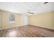 Bedroom with neutral walls, a ceiling fan, and a window for natural light at 1379 Paddocks Way, Powder Springs, GA 30127