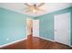 A bedroom with wood floors, a ceiling fan and two closets at 1379 Paddocks Way, Powder Springs, GA 30127