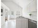 Cozy kitchen with white cabinets, stainless steel appliances, and a bright window offering natural light at 1379 Paddocks Way, Powder Springs, GA 30127