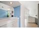 Open kitchen with stainless steel appliances, white countertops, and a view into the living room through an arched opening at 1379 Paddocks Way, Powder Springs, GA 30127