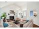 Comfortable living room with hardwood floors, fireplace, vaulted ceiling, and stylish furniture in an open concept design at 1379 Paddocks Way, Powder Springs, GA 30127