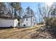 Back exterior showcasing a deck, shed, and grassy lawn at 1490 Broad Ne St, Conyers, GA 30012