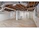 Unfinished basement featuring exposed ceiling, utility connections, and white walls at 1490 Broad Ne St, Conyers, GA 30012