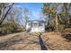 Charming exterior of a house with a porch and landscaped front yard at 1490 Broad Ne St, Conyers, GA 30012