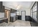 Kitchen features ample storage cabinets and sleek countertops, enhanced by natural light at 1490 Broad Ne St, Conyers, GA 30012