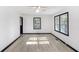 Bright living room with black trimmed windows, baseboards and light wood floors at 1490 Broad Ne St, Conyers, GA 30012