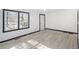 Bright living room with black trimmed windows, baseboards and light wood floors at 1490 Broad Ne St, Conyers, GA 30012