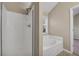 Bathroom featuring a shower and soaking tub at 1538 Park Grove Dr, Lawrenceville, GA 30046