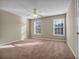 This large bedroom has 2 windows that look out onto trees at 1538 Park Grove Dr, Lawrenceville, GA 30046