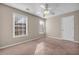 Bright bedroom with carpet, ceiling fan and two windows at 1538 Park Grove Dr, Lawrenceville, GA 30046