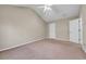 Spacious bedroom with neutral tones and a vaulted ceiling is equipped with a ceiling fan at 1538 Park Grove Dr, Lawrenceville, GA 30046