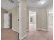 Bright hallway with neutral walls and carpet flooring at 1538 Park Grove Dr, Lawrenceville, GA 30046