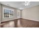 Spacious living room features hardwood floors, fireplace and ceiling fan at 1538 Park Grove Dr, Lawrenceville, GA 30046