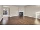 Spacious living room features hardwood floors, fireplace and ceiling fan at 1538 Park Grove Dr, Lawrenceville, GA 30046