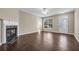 Spacious living room features hardwood floors, fireplace and ceiling fan at 1538 Park Grove Dr, Lawrenceville, GA 30046