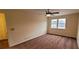 Spacious bedroom with ceiling fan and neutral carpeting at 2082 Montgomery Trl, Duluth, GA 30096