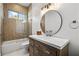 Clean bathroom with tub, shower, and modern vanity at 2220 Meadowvale Ne Dr, Atlanta, GA 30345