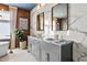 Modern bathroom with double vanity and marble tile at 2220 Meadowvale Ne Dr, Atlanta, GA 30345