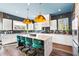 Modern kitchen with white cabinets, a large island, and gold pendant lights at 2220 Meadowvale Ne Dr, Atlanta, GA 30345