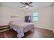 Cozy bedroom with wood floors and hanging rack at 102 Chip Pl, Stockbridge, GA 30281