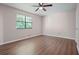 Spacious bedroom with wood flooring and large window at 102 Chip Pl, Stockbridge, GA 30281