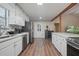 Updated kitchen featuring white cabinets, granite counters at 102 Chip Pl, Stockbridge, GA 30281