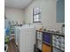 Laundry area with washer, dryer, and ample storage at 102 Chip Pl, Stockbridge, GA 30281