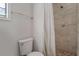 Clean shower with tile surround and pebble floor at 102 Chip Pl, Stockbridge, GA 30281