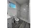 Modern bathroom with a large marble shower and grey flooring at 1840 Judy Se Cir, Marietta, GA 30060