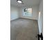 Bright bedroom featuring neutral carpet and a large window at 1840 Judy Se Cir, Marietta, GA 30060