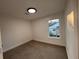 Well-lit bedroom with neutral wall paint and carpeted floor at 1840 Judy Se Cir, Marietta, GA 30060